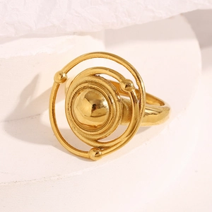 Macro detail of 18K gold plated multi-layer orbital ring on white geometric background