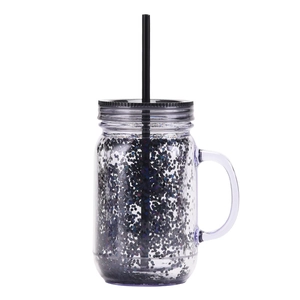 Detail of double-walled plastic mason tumbler with black glitter and matching straw