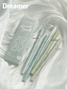 Detail of four-piece double-headed Morandi highlighters on soft white silk fabric
