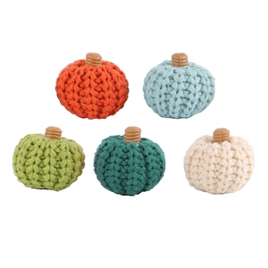 Set of five handmade knitted pumpkin ornaments in assorted colors for party decor