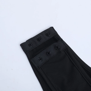 Close-up of the three-button snap crotch closure on a black ribbed knit satin bodysuit