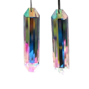 Macro detail of long multifaceted crystal prism pendants with vibrant rainbow reflections
