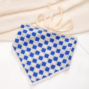 Detailed flat lay of blue and cream checkered crochet bandana with soft knit texture