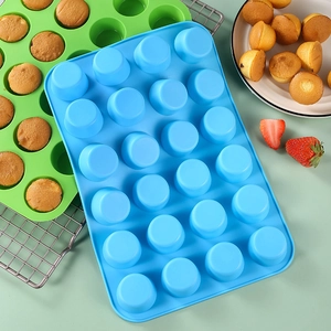 24-cavity silicone muffin pan in blue and green for high-temperature kitchen baking
