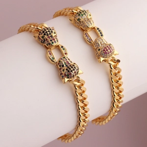 Close-up of hip hop Cuban link bracelet featuring micro-pave colored zircon leopard heads