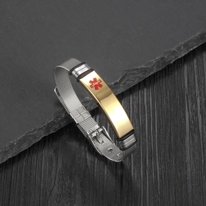 Detailed close-up of medical alert bracelet with golden Caduceus symbol and mesh band