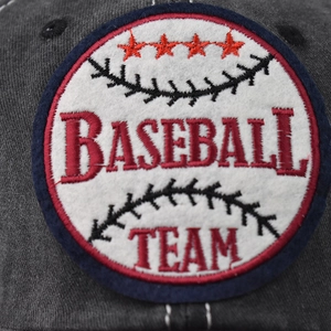 Detailed close-up of a vintage baseball team embroidery on a grey washed cotton cap