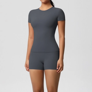 Detail of high-stretch seamless charcoal grey athletic tee and shorts yoga set for women