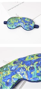 Detailed macro view of Van Gogh Irises silk sleep mask texture and elastic strap