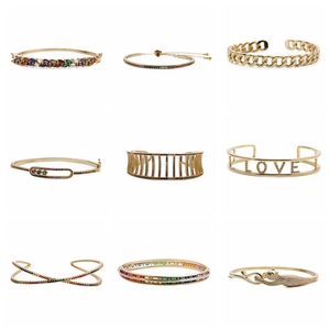 Collection of nine gold cubic zirconia bracelets featuring leopard and love designs