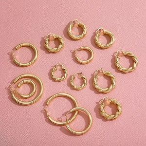 Set of minimalist 18K gold plated hoop earrings with smooth and twisted textures