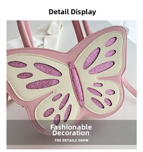 Close-up of pink and white butterfly-shaped bag featuring purple glitter wing details