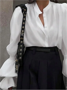 Elegant white lantern sleeve shirt with ruffled collar and black pleated skirt outfit