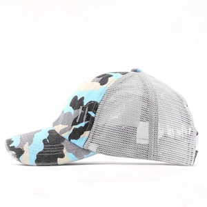 Side view of camo ponytail baseball cap with breathable mesh and distressed brim detail