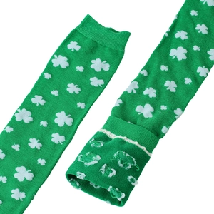 Detail of green St. Patrick's Day thigh high socks with white clover pattern and ribbed cuff