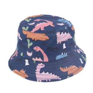 Close-up of kids navy bucket hat featuring colorful cartoon dinosaur prints and fabric texture