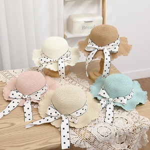 Five colors of kids straw hats with polka dot bow and wavy brim for beach sun protection