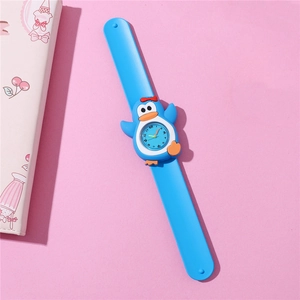 Macro view of blue silicone penguin slap watch for kids with cartoon design