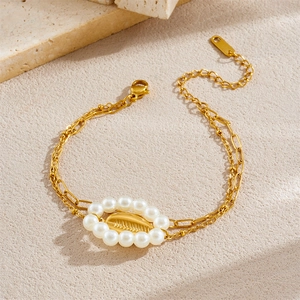 Elegant gold-plated bracelet with double chain layers featuring pearls and shell accents