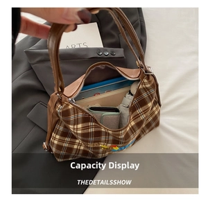 Internal capacity display of brown plaid tote bag showing tablet, phone, and umbrella