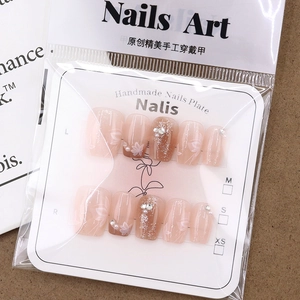 Pink gradient handmade press-on nails with floral patterns, pearls and sparkling rhinestones