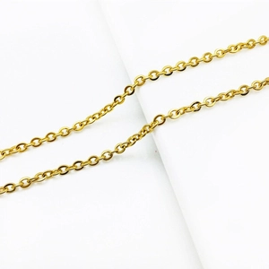 Macro shot of detailed golden O-link chain necklace showing polished metal texture