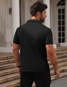 Detailed back view of a men's black waffle polo shirt showing fabric texture and collar cut