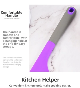 Detail of ergonomic silicone spatula handle with integrated hanging hole for kitchen storage