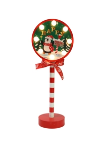 Close-up of LED Christmas penguin road sign light with red striped pole and bow