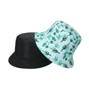 Detail of reversible sun hat showing black side and blue cactus print pattern