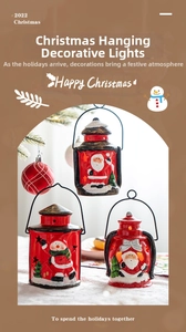 Detail of vintage red Christmas lantern with 3D Santa Claus and warm LED light effect