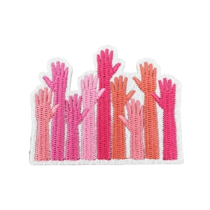 Pink breast cancer awareness ribbons and raised arm embroidery patches on white background