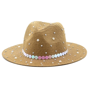 Brown woven Fedora straw hat with pearls, rhinestones and colorful sequin band on white background