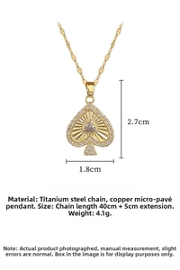 Detail view of gold spade pendant necklace with measurements showing size and dimensions