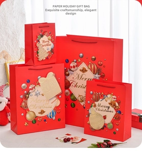 Detailed stack of four red Merry Christmas paper gift bags in various sizes with handles