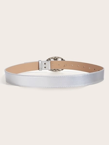 Detail of silver rhinestone belt with brown leather lining and adjustable metal buckle