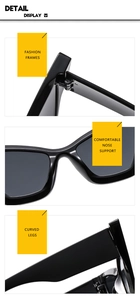 Detail display of black cat eye sunglasses showing hinge, nose pads and curved temples