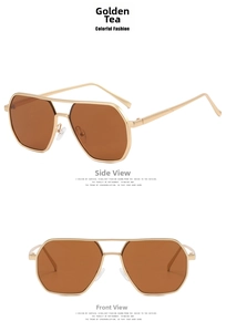 Detail view of aviator sunglasses with amber gold lenses and metallic double bridge frame