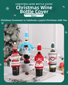 Detail of four creative knitted Christmas wine bottle covers with hats in festive designs