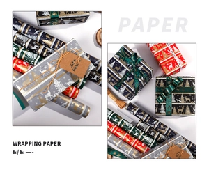 Detail of Christmas wrapping paper rolls with festive reindeer and snowflake patterns