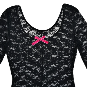 Close-up of black floral lace bodysuit featuring a small pink decorative bow on the neckline