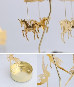 Detailed views of golden metal spinning candle holder with unicorn and fairy charms