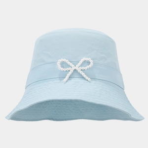 Detail of light blue bucket hat featuring pearl bow accent and matching ribbon trim