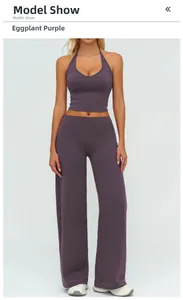 Front view of eggplant purple yoga set featuring halter neck top and high-waist wide-leg pants