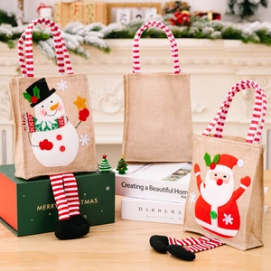 Jute Christmas gift bags with cartoon snowman and Santa claus designs and striped legs