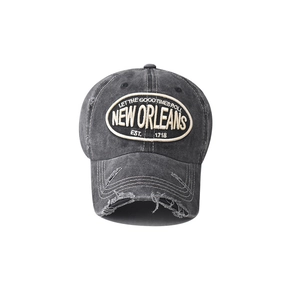 Close-up of distressed cotton baseball cap featuring vintage New Orleans embroidery