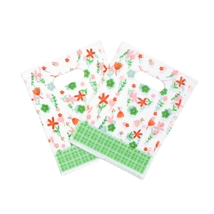 Floral plastic gift bags with green check pattern for boutique shopping and retail use