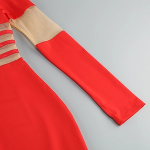 Detail view of red mesh panel splicing and horizontal line decor on a bodycon dress