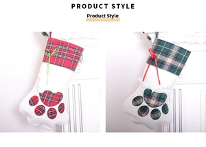 Close-up of cat paw Christmas stockings with red and green plaid patterns on white fur