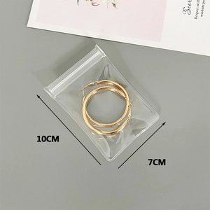 Clear 10x7cm self-sealing packaging bag for organizing gold hoop earrings
